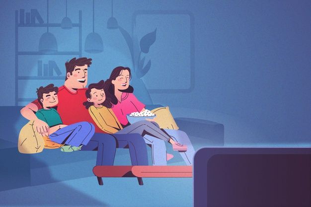 a family sitting on a couch watching tv