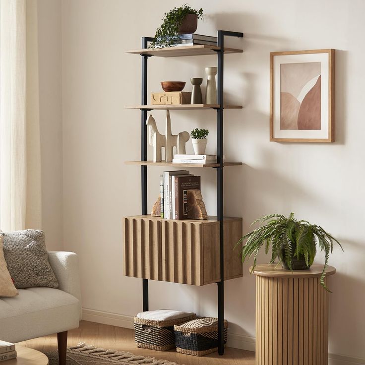 a living room filled with furniture and a potted plant on top of a shelf