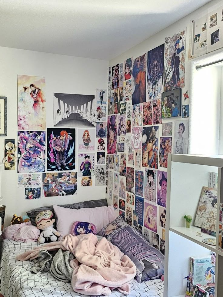 a bedroom with lots of pictures on the wall and a bed in front of it