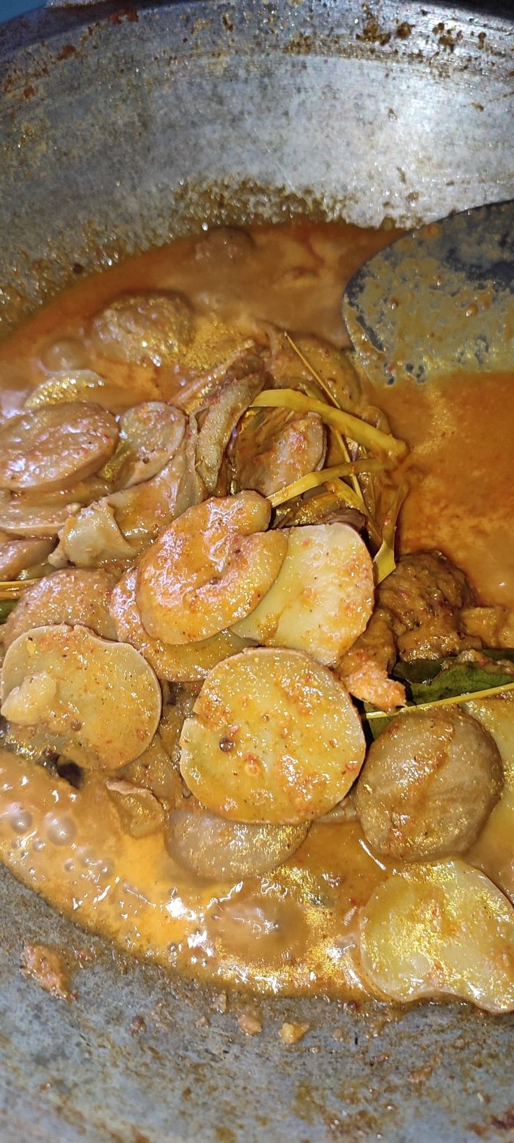 the food is being cooked in the pan on the stove top, and ready to be eaten