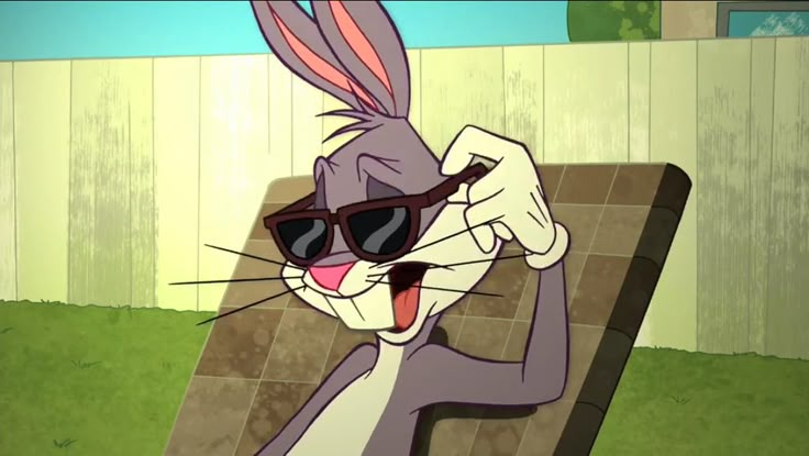 a cartoon rabbit with sunglasses on sitting in a chair and holding his head up to the side