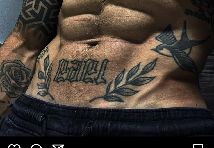 a man with tattoos on his stomach and chest