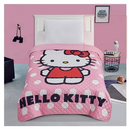 a hello kitty bed set with polka dots