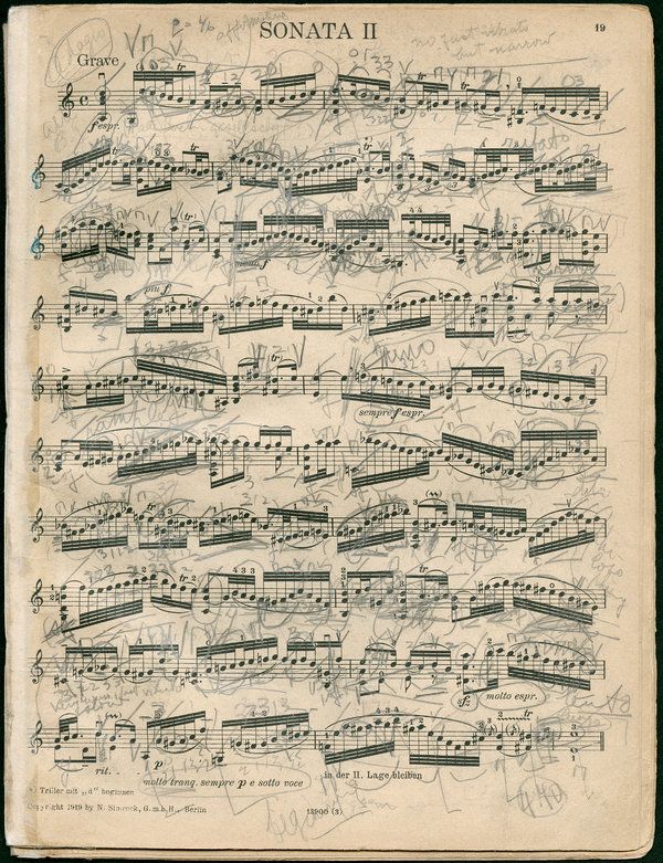 an old sheet with musical notes written in black ink on white paper, and the words sonate ii