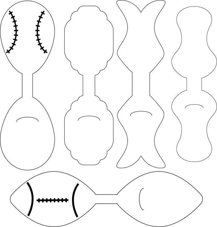 paper cut out of different shapes and sizes to make a football, fish, and ball