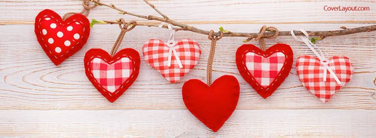 red and white hearts hanging from a branch with gingham checkered fabric on them