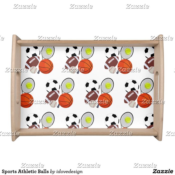 a tray with sports balls and tennis rackets on it, in the shape of a basketball