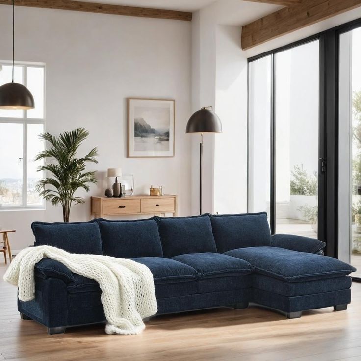 a living room with a large blue couch