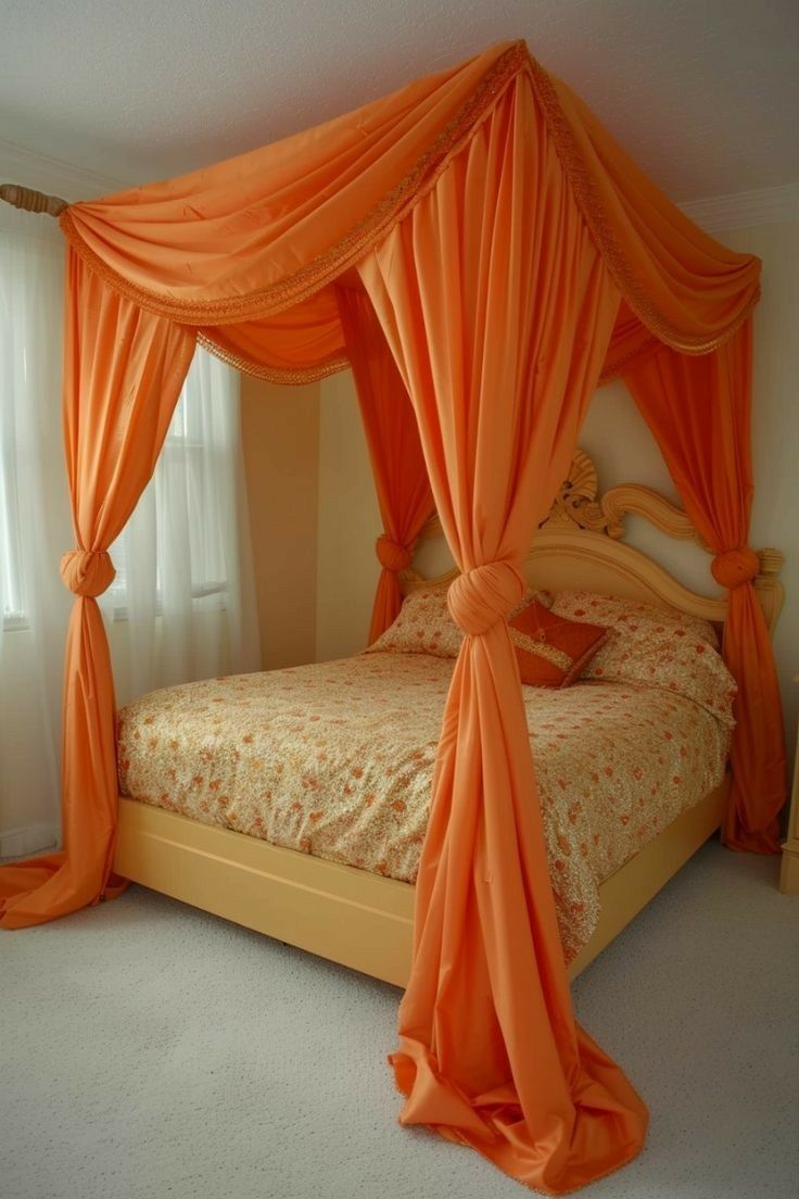 an orange canopy bed in a bedroom next to a window with curtains on the sides