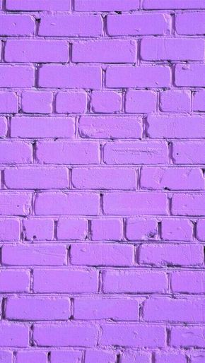 a pink brick wall that has been painted