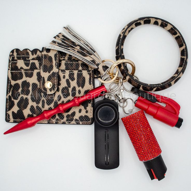 an animal print purse with keys and other items