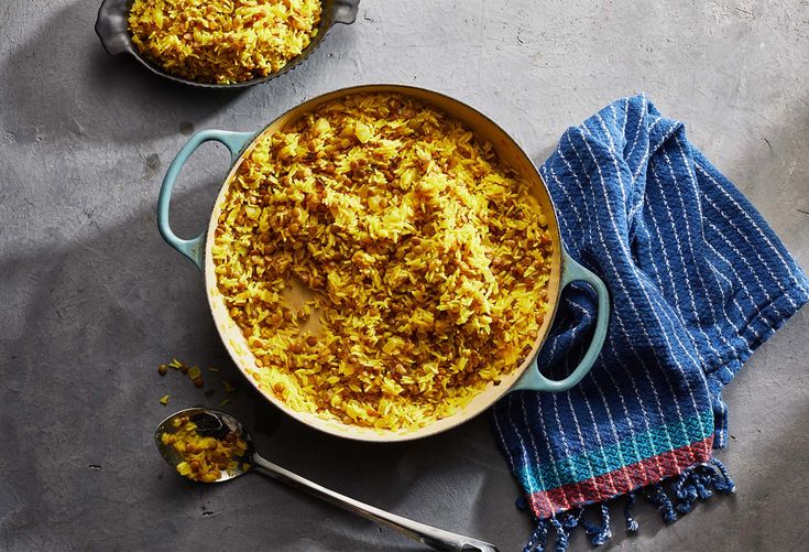 two pans filled with food sitting on top of a table