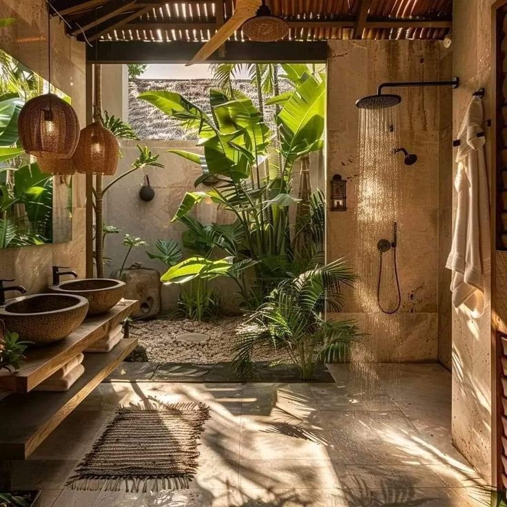 an outdoor shower with plants in it and two sinks under the faucet, surrounded by greenery