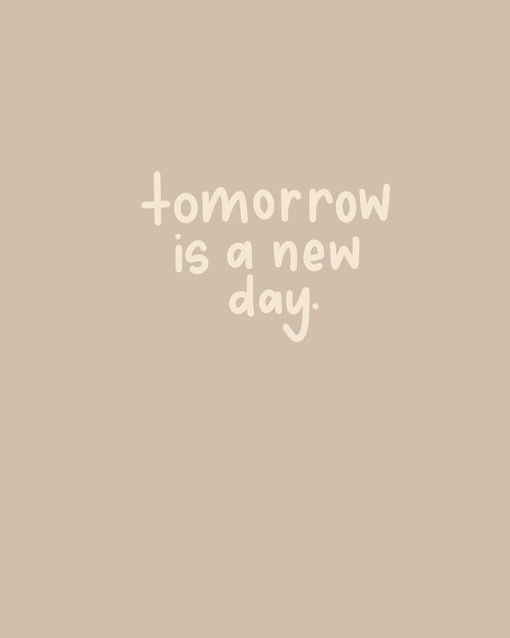 the words tomorrow is a new day written in white ink on a beige background with a black