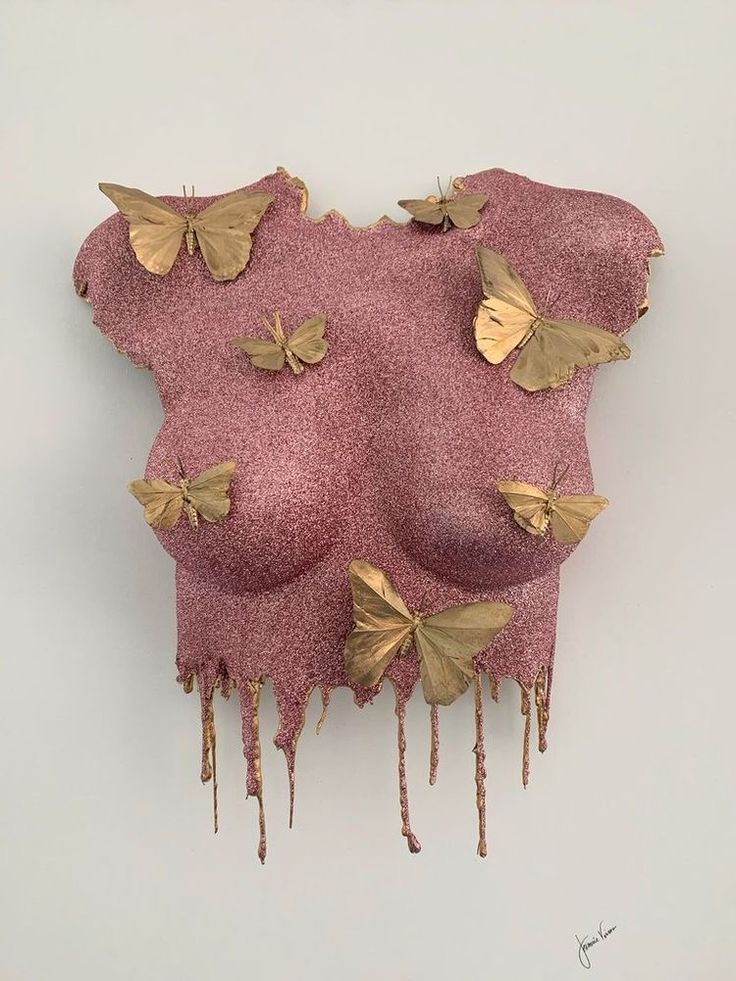 a piece of art that has been made to look like some kind of pink fabric with gold butterflies on it