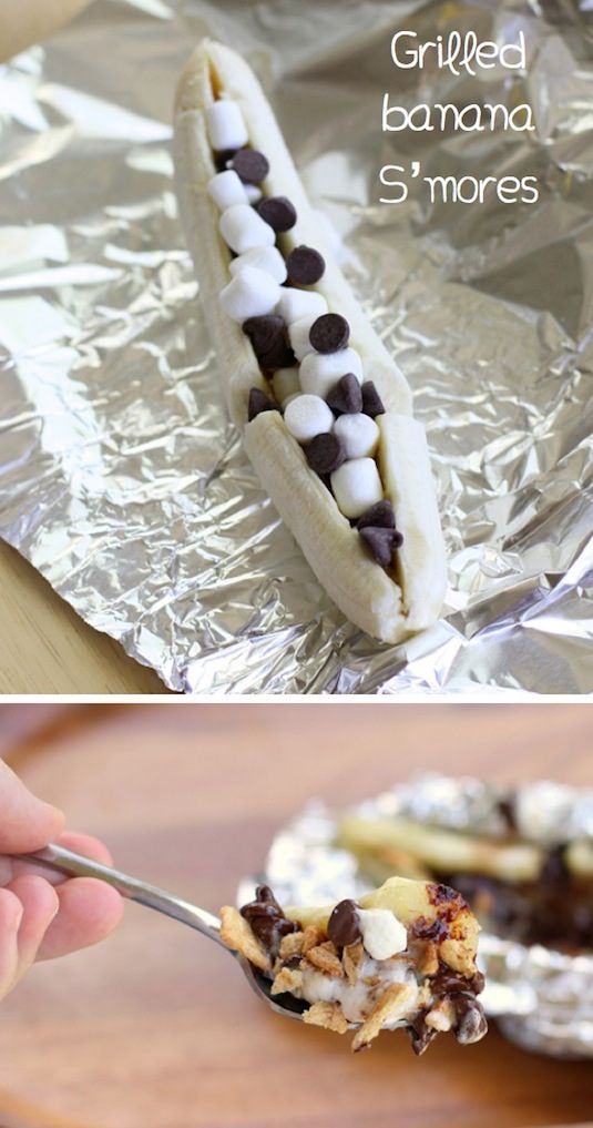 a banana with marshmallows and chocolate chips in it on aluminum foil,