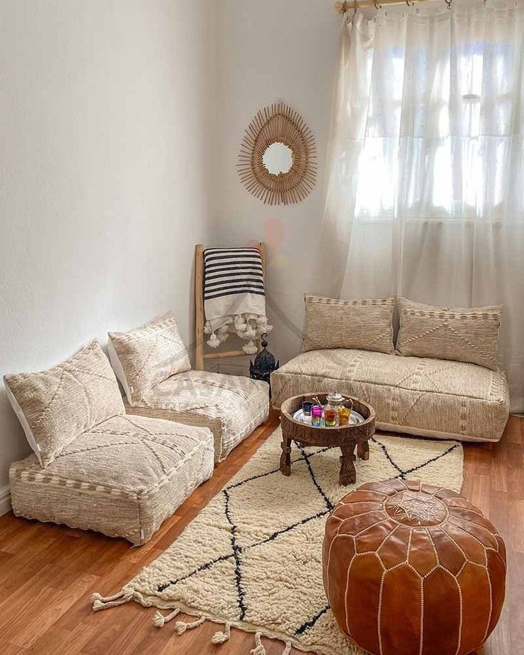 a living room with two couches and a coffee table in front of a window