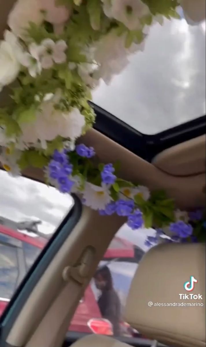 the interior of a car is decorated with flowers