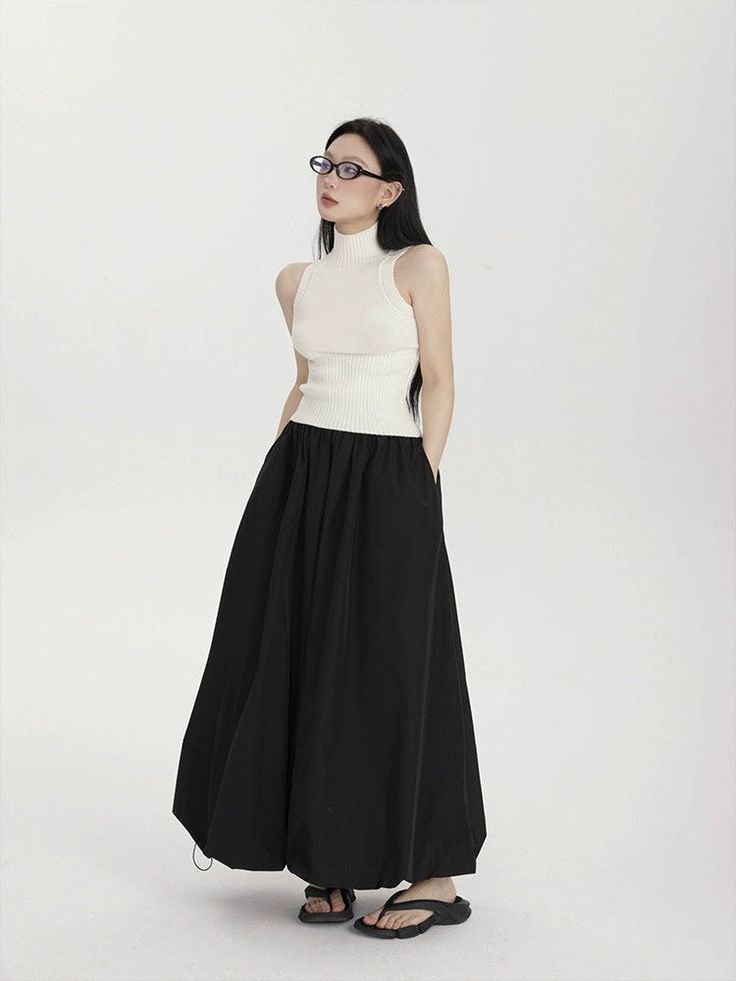 Make a fashion-forward statement with the High-Waisted Balloon Maxi Skirt with Pockets, a contemporary twist on classic femininity. Crafted for effortless charm, this skirt's high waist design cinches to define your silhouette, while the balloon-inspired maxi length billows with a carefree aesthetic. The crisp solid color palette and subtle sheen of the 100% polyester fabric complement the skirt's street-savvy style, while the convenience of pockets adds a practical touch. Dress it down with a t Bubble Maxi Skirt, Parachute Maxi Skirt, Maxi Bubble Skirt, Balloon Skirt Outfit, Black Pleated Maxi Skirt, Black Maxi Skirt Outfit, Carefree Aesthetic, Skirt Street Style, A Line Skirt Outfits