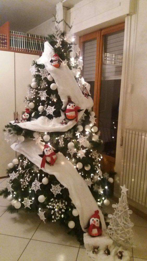 a christmas tree decorated with white and black ornaments