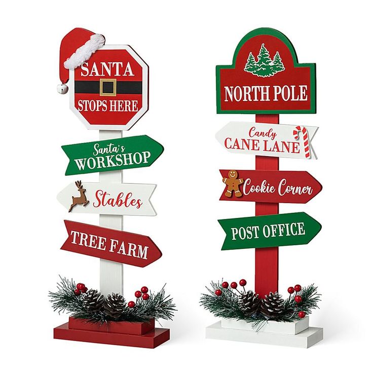 two wooden signs with santa's workshop, santa stop sign, candy cane lane, tree farm and north pole