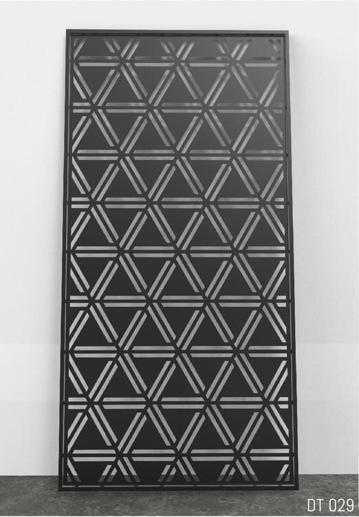 a black and white photo of a geometric design on a wall in an art gallery