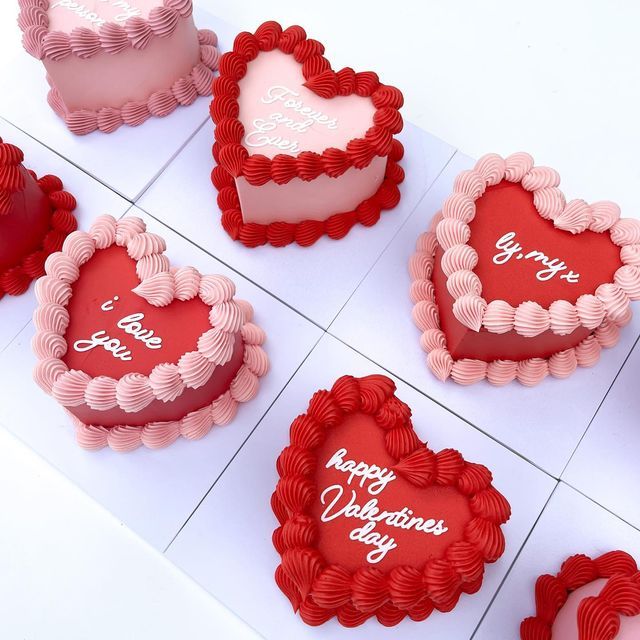 valentine's day heart shaped cakes are arranged on the counter for display in this image