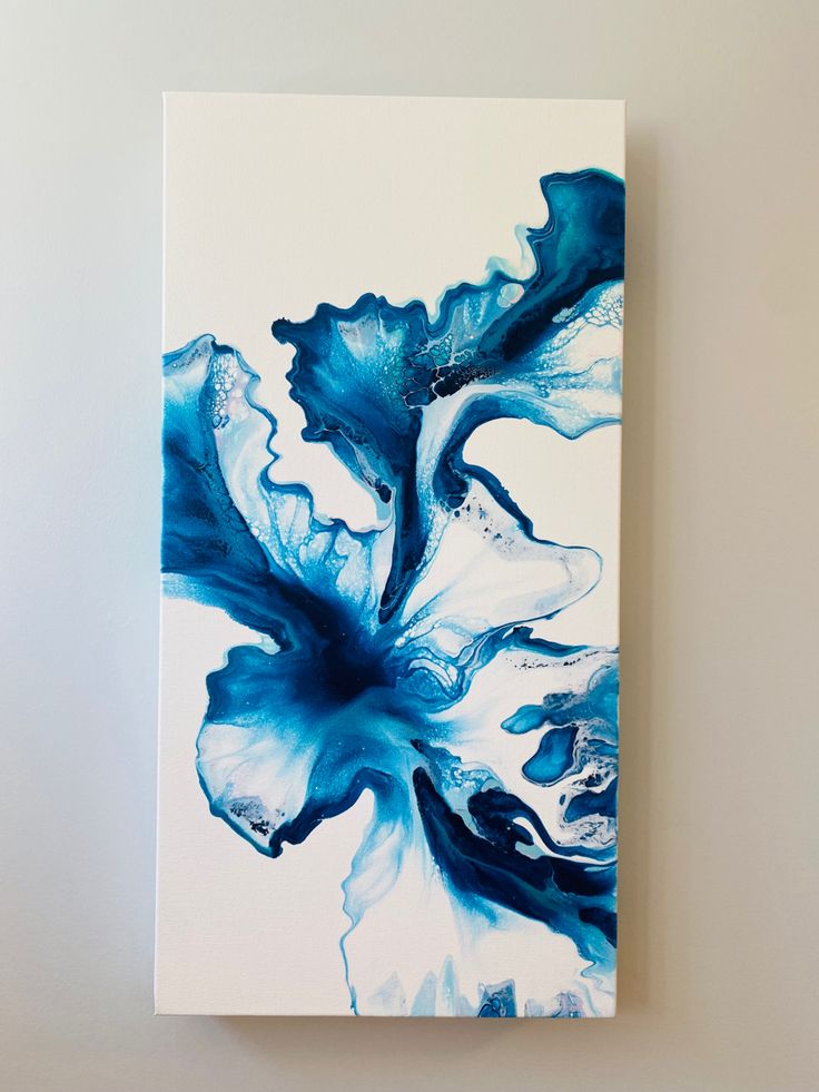 an abstract painting with blue and white colors on a white background is featured in this image