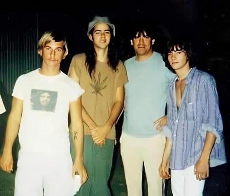 a group of young men standing next to each other