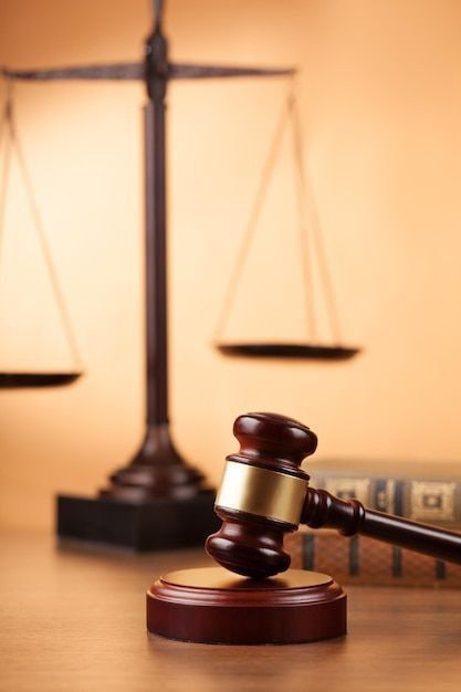 a wooden judge's gavel sitting on top of a table