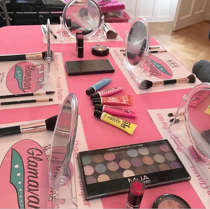 the table is covered with cosmetics and makeup products