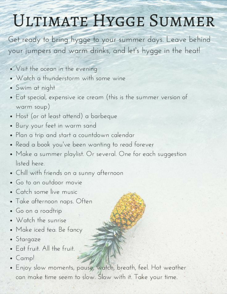 a pineapple sitting on top of a sandy beach next to the ocean with words written below it