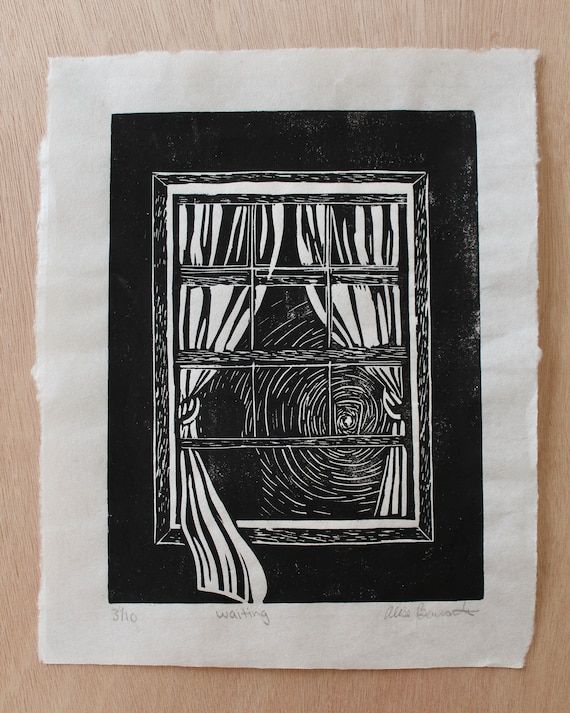 a black and white drawing of a window with curtains on the outside, in front of a wooden table