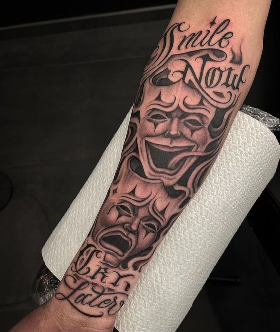 a person with a tattoo on their arm that says smile not, and an evil clown