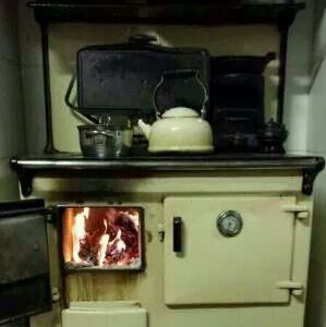 an old fashioned stove in the corner of a room