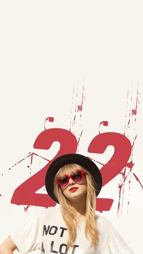 a woman wearing sunglasses and a hat standing in front of a wall with the number 22 on it