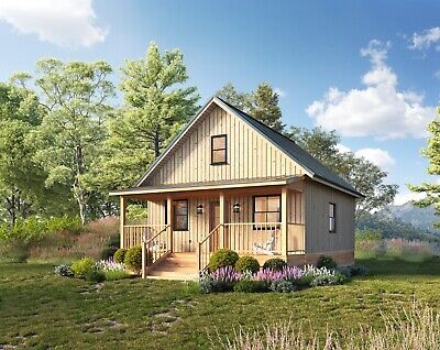 a small wooden house sitting on top of a lush green field