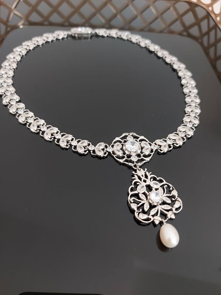 Elegant Sterling Silver Necklace With Jewels, Elegant Bridal Necklace For Anniversary, Formal Jeweled Pendant Necklace, Handmade Long Elegant Necklace, Victorian Jewelry With Historical Design For Evening, Elegant Pearl Necklace With Intricate Design, Ornate Historical Design Necklace For Formal Occasions, Ornate Historical Design Necklaces For Formal Occasions, Elegant Formal Drop Necklace