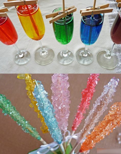 there are many different colored drinks in the vases with toothpicks stuck to them