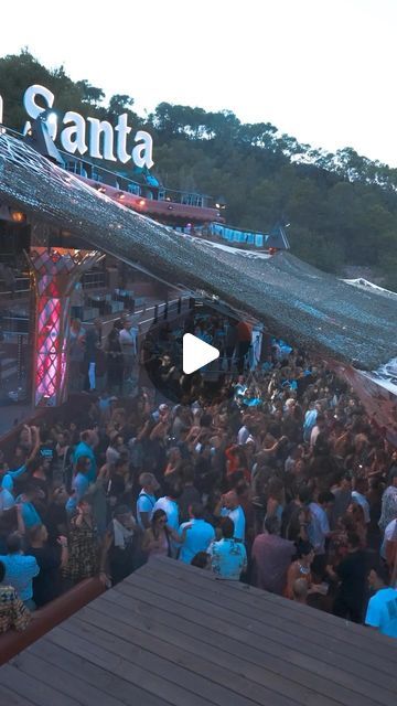 a group of people standing around in front of a stage