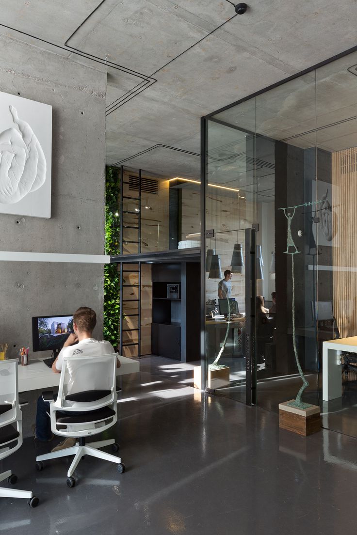 a man sitting at a desk in an office