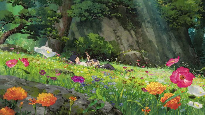 an anime scene with flowers and people in the grass near some rocks, one person laying down