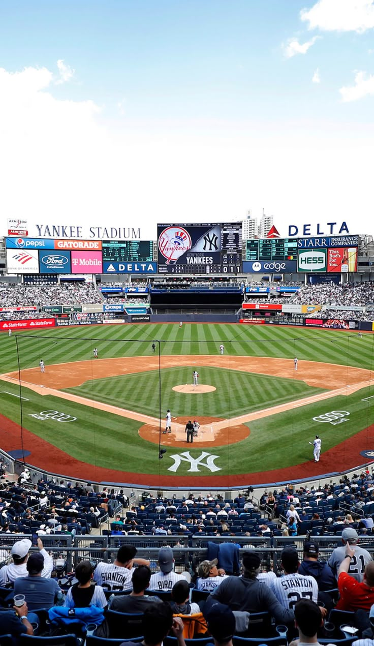 a baseball stadium filled with lots of people