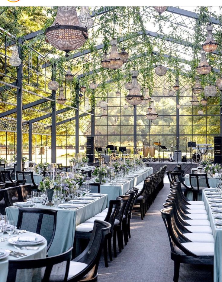 an outdoor dining area with tables and chairs set up for a formal function in the sun