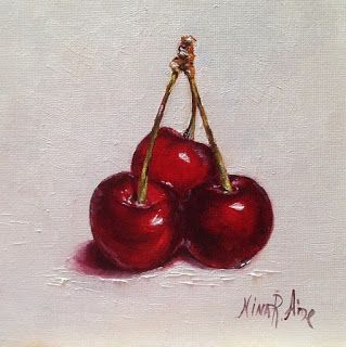 two cherries sitting on top of each other