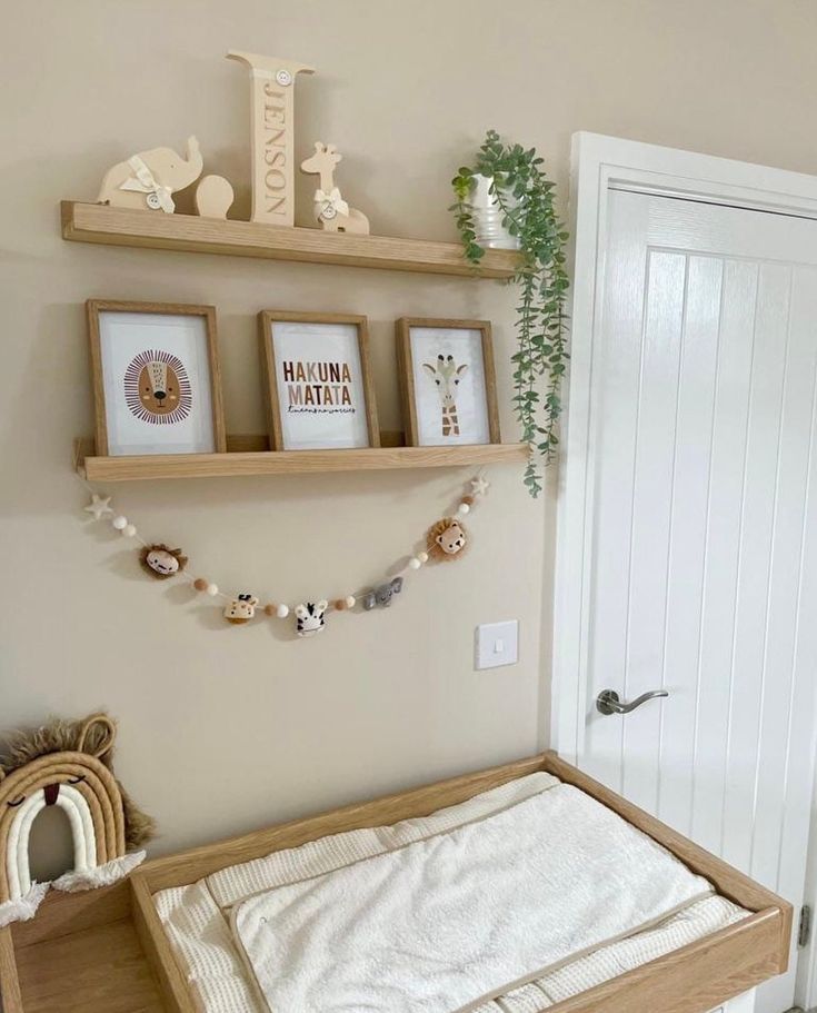 a baby's crib with two wooden shelves above it