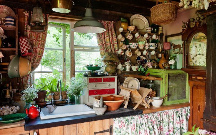 an old fashioned kitchen with lots of pots and pans