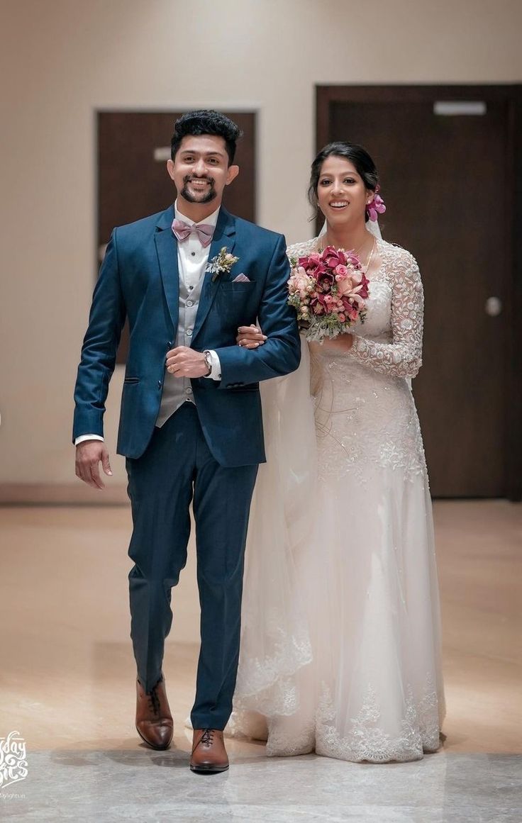 the bride and groom are walking down the aisle at their wedding ceremony in an empty building