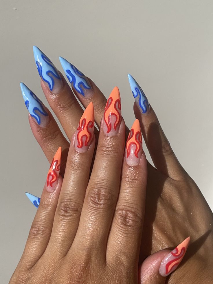 Nail design, blue flame nails and orangy red flame nails Short Flame Nails Designs, Blue Fire Nails Designs, Grey Flame Nails, Red And Orange Flame Nails, Blue Drip Nails, One Hand Red One Hand Blue Nails, Fire Themed Nails, Nail Designs Orange And Blue, Fire Sign Nails