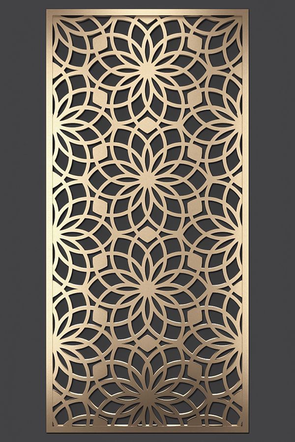 an intricate laser cut panel in gold